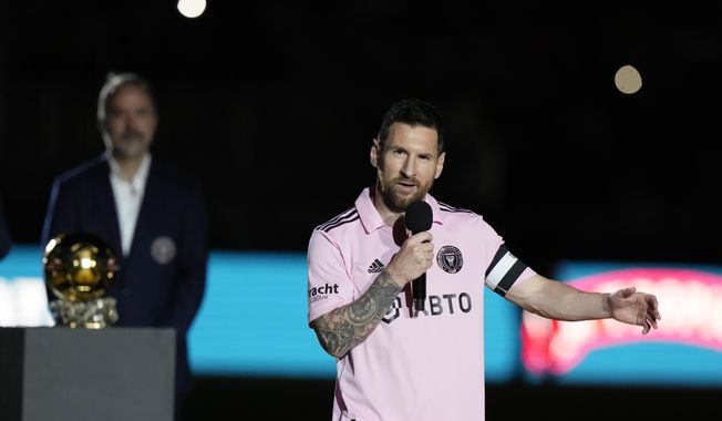 Inter Miami forward Lionel Messi speaks during a ceremony honoring his Ballon d&#x27;Or trophy, before the team&#x27;s club friendly soccer match against New York City FC, Friday, Nov. 10, 2023, in Fort Lauderdale, Fla. (AP Photo/Lynne Sladky)