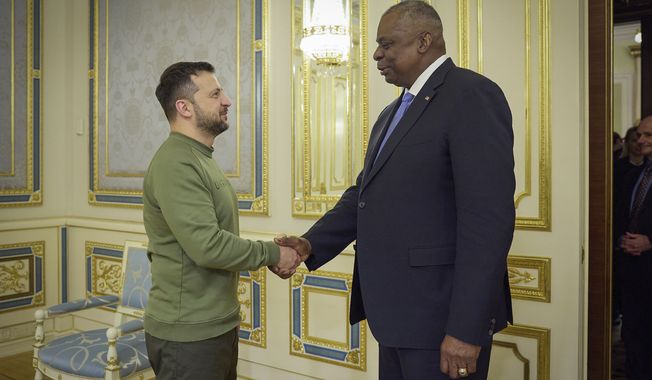 In this photo provided by the Ukrainian Presidential Press Office, Ukrainian President Volodymyr Zelenskyy, left, shakes hands with U.S. Secretary of Defense Lloyd Austin in Kyiv, Ukraine, Monday, Nov. 20, 2023. (Ukrainian Presidential Press Office via AP)