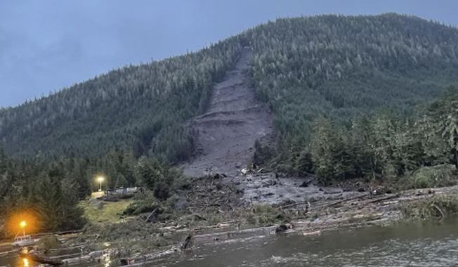 This photo provided by the Alaska Department of Public Safety shows the landslide that occurred the previous evening near Wrangell, Alaska, on Nov. 21, 2023. Authorities said at least one person died and others were believed missing after the large landslide roared down a mountaintop into the path of three homes. (Alaska Department of Public Safety via AP)
