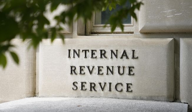 A sign outside the Internal Revenue Service building is seen, May 4, 2021, in Washington. (AP Photo/Patrick Semansky, File)