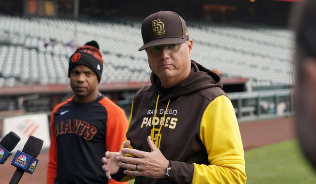 Then-San Diego Padres third base coach Mike Shildt, right, speaks at a news conference next to San Francisco Giants first base coach Antoan Richardson before a baseball game in San Francisco on April 13, 2022. Shildt has been hired as manager of the San Diego Padres, returning to the dugout two years after he was suddenly fired by the St. Louis Cardinals following a third straight playoff appearance, a person with knowledge of the situation said Tuesday, Nov. 21, 2023.