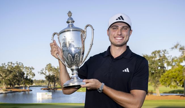 Ludvig 脜berg, of Sweden, holds the trophy after the final round of the RSM Classic golf tournament, Sunday, Nov. 19, 2023, in St. Simons Island, Ga. (AP Photo/Stephen B. Morton) **FILE**