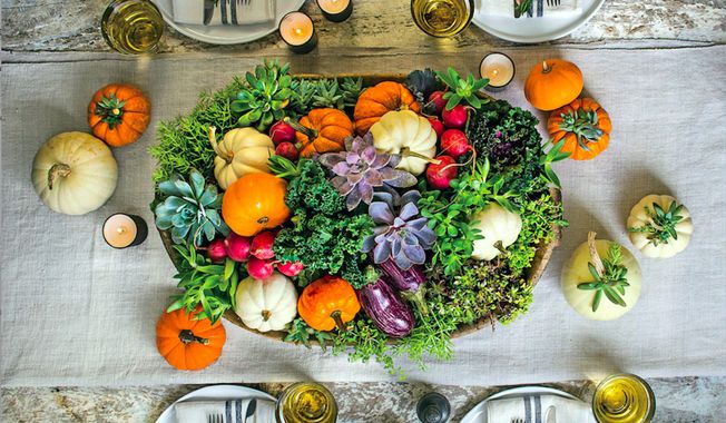 This image provided by Southern Living magazine shows a tabletop garden centerpiece with small bunches of kale, herbs, ornamentals and even radishes (for a punch of red). (Laurey W. Glenn/Southern Living via AP)