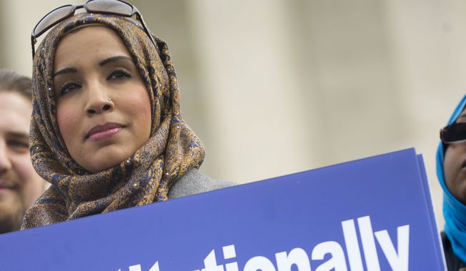 Zainab Chaudry joins other demonstrators outside the Supreme Court in Washington, on Wednesday, Feb. 25, 2015. The Maryland Attorney General this week, Tuesday, Nov. 21, 2023, suspended Chaudry, a member of the state鈥檚 new commission aimed at addressing hate crimes, after she posted on social media criticizing the recent actions of Israel in Gaza. (AP Photo/Pablo Martinez Monsivais, File)