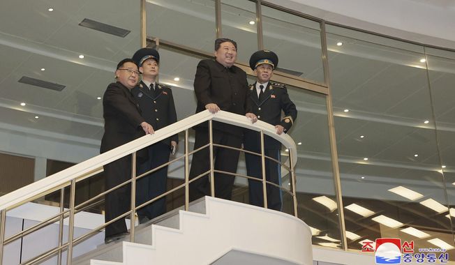In this photo provided by the North Korean government, North Korean leader Kim Jong Un watches conditions of a satellite at a satellite control center in Pyongyang, North Korea, Wednesday, Nov. 22, 2023, after North Korea鈥檚 space agency said its new 鈥淐hollima-1鈥� carrier rocket accurately placed the Malligyong-1 satellite into orbit on Tuesday night. Independent journalists were not given access to cover the event depicted in this image distributed by the North Korean government. The content of this image is as provided and cannot be independently verified. Korean language watermark on image as provided by source reads: &quot;KCNA&quot; which is the abbreviation for Korean Central News Agency. (Korean Central News Agency/Korea News Service via AP)