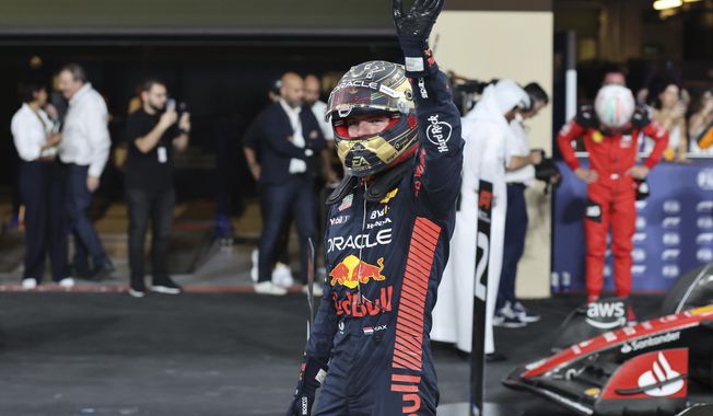 Red Bull driver Max Verstappen of the Netherlands waves after qualifying session ahead of the Abu Dhabi Formula One Grand Prix at the Yas Marina Circuit, Abu Dhabi, UAE, Saturday, Nov. 25, 2023. (Ali Haider/Pool via AP)