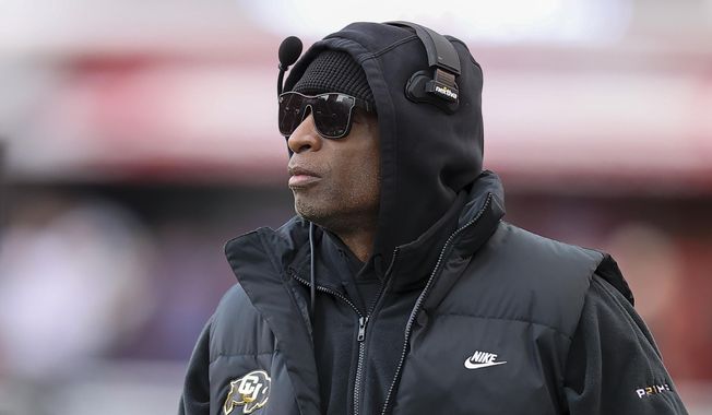Colorado head coach Deion Sanders looks on against Utah during the second quarter of an NCAA college football game Saturday, Nov. 25, 2023, in Salt Lake City. (AP Photo/Rob Gray)