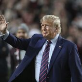 Republican presidential candidate and ormer President Donald Trump waves during halftime of an NCAA college football game between South Carolina and Clemson, Saturday, Nov. 25, 2023, in Columbia, S.C. (AP Photo/Artie Walker Jr.)