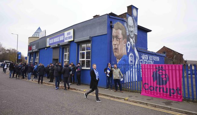 Everton supporters stands by a bar prior to the start of the English Premier League soccer match between Everton and Manchester United, at Goodison Park Stadium, in Liverpool, England, Sunday , Nov. 26, 2023. (AP Photo/Jon Super)