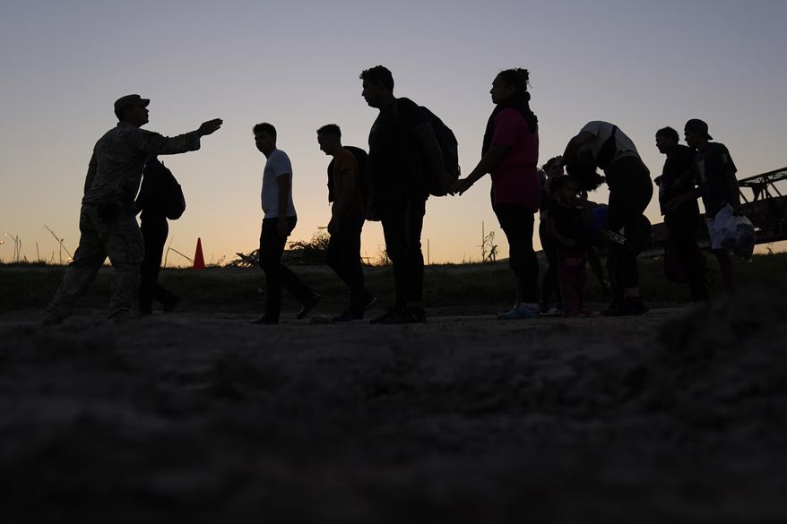 Migrants who crossed the Rio Grande and entered the U.S. from Mexico are lined up for processing by U.S. Customs and Border Protection, Sept. 23, 2023, in Eagle Pass, Texas. As Congress returns this week, Senate Republicans have made it clear they won’t support additional war aid for Ukraine unless they can pair it with border security measures. (AP Photo/Eric Gay) **FILE**