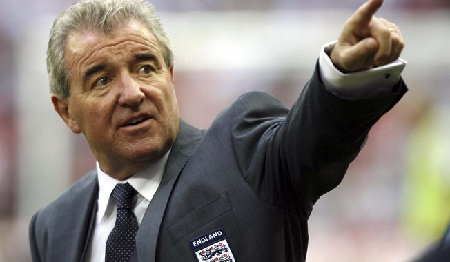 FILE - England&#x27;s assistant coach Terry Venables points before their international friendly soccer match against Brazil at Wembley Stadium, London, Friday June 1, 2007. Former England, Tottenham and Barcelona manager Terry Venables has died, it was announced Sunday, Nov. 26, 2023. He was 80. (AP Photo/Tom Hevezi, file)