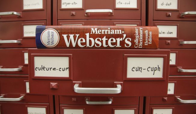 A Merriam-Webster dictionary sits atop their citation files at the dictionary publisher&#x27;s offices in Springfield, Mass. Merriam-Webster&#x27;s word of the year for 2023 is &quot;authentic. &quot;(AP Photo/Stephan Savoia, File)