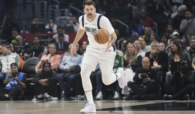 Dallas Mavericks&#x27; Luka Doncic brings the ball up during the first half of the team&#x27;s NBA basketball game against the Los Angeles Clippers on Saturday, Nov. 25, 2023, in Los Angeles. (AP Photo/Jae C. Hong)