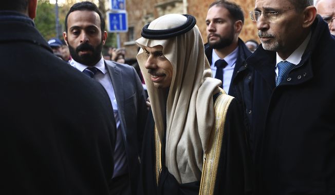 Saudi Foreign Minister Prince Faisal bin Farhan arrives to support the candidacy of Riyadh, Tuesday, Nov. 28, 2023 in Issy-les-Moulineaux, outside Paris. In a high-profile showdown, Rome, Busan, and Riyadh are the top contenders as the Bureau International des Expositions (BIE) prepares to vote on Tuesday in Paris for the host city of the 2030 World Expo. (AP Photo/Aurelien Morissard)