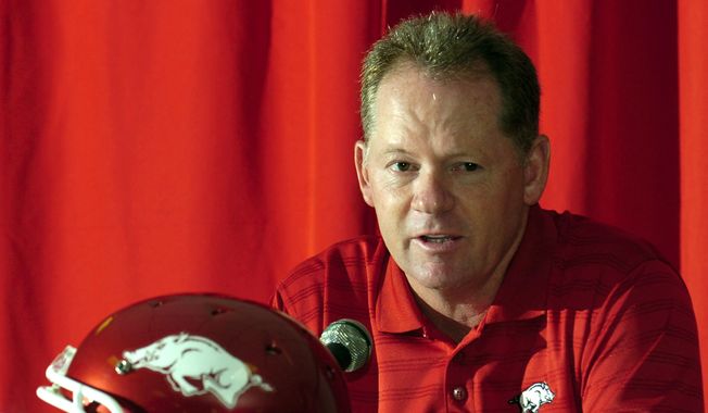 Arkansas football coach Bobby Petrino answers a question during media day at the Broyles Center in Fayetteville, Ark., Tuesday, Aug. 5, 2008. Arkansas announced Wednesday, Nov. 29, 2023, it is bringing back Bobby Petrino to be offensive coordinator, 11 years after he was fired as head coach in a sordid scandal that involved a motorcycle accident, an affair with a woman who worked for him and being untruthful to his bosses.(AP Photo/April L. Brown, File)