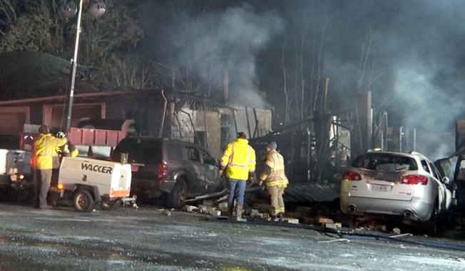 In this image taken from video provided by WCPO, emergency personnel work at the scene of a deadly fire at Jimbo鈥檚 Auto Repair, Tuesday, Nov. 28, 2023, in Hillsboro, Ohio. An explosion at the auto repair shop in Ohio that killed three people and sent a fourth person to a hospital sparked a massive fire that burned for hours and spewed thick, black smoke into the air (WCPO via AP)