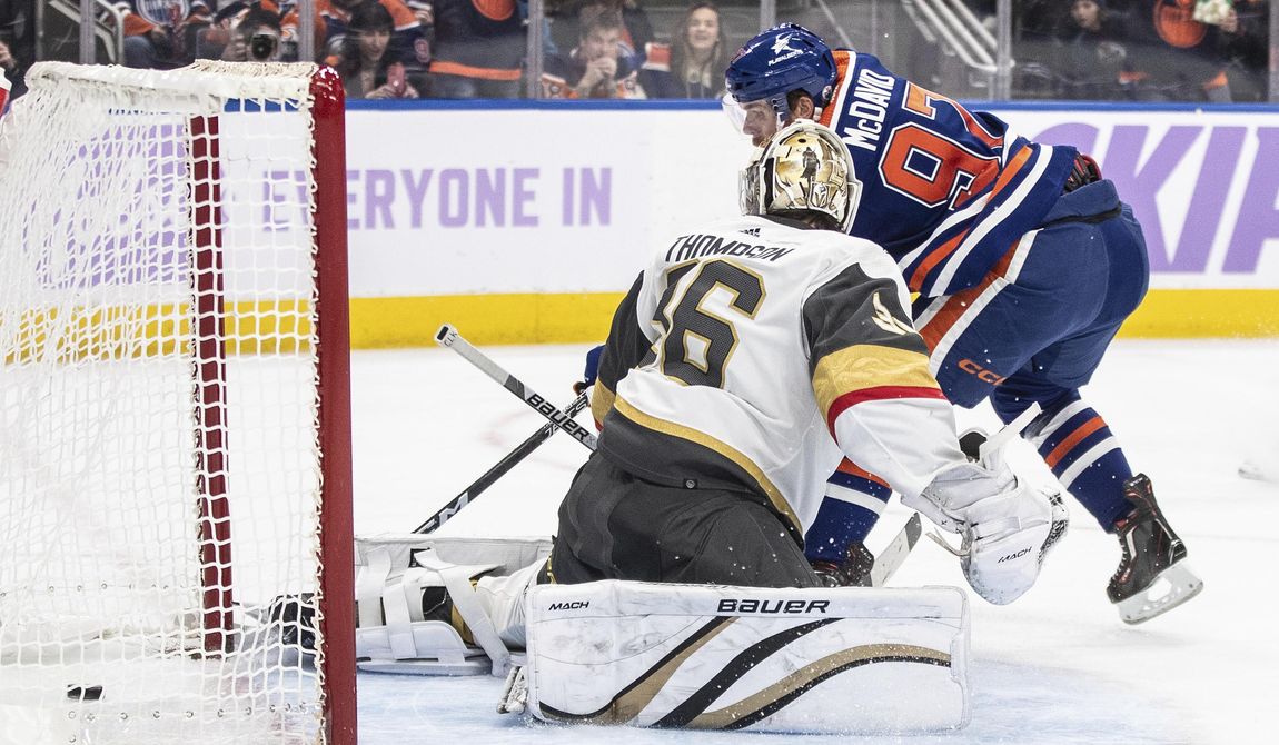 Vegas Golden Knights goalie Logan Thompson is scored on by Edmonton Oilers&#x27; Connor McDavid during the second period of an NHL hockey game in Edmonton, Alberta, on Tuesday, Nov. 28, 2023. (Jason Franson/The Canadian Press via AP)