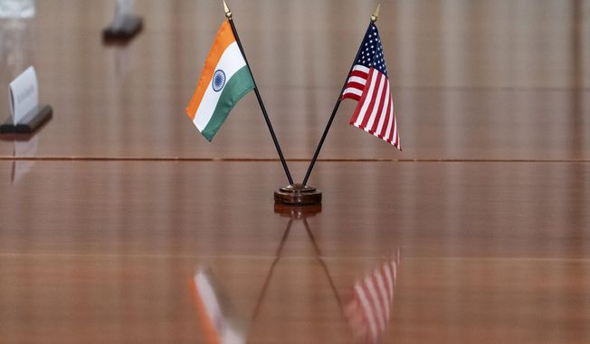 The countries' flags are seen on the table during a meeting with India's Foreign Minister Subrahmanyam Jaishankar and U.S. Secretary of Defense Lloyd Austin at the Pentagon in Washington on Monday, Sept. 26, 2022. (AP Photo/Alex Brandon) **FILE**