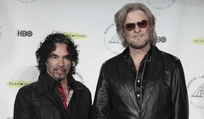 Hall of Fame Inductees, Hall &amp; Oates, John Oates and Daryl Hall appear in the press room at the 2014 Rock and Roll Hall of Fame Induction Ceremony on April 10, 2014, in New York. Hall has sued his longtime music partner John Oates, arguing that his plan to sell off his share of a joint venture would violate a business agreement the duo had. (Photo by Andy Kropa/Invision/AP, File)