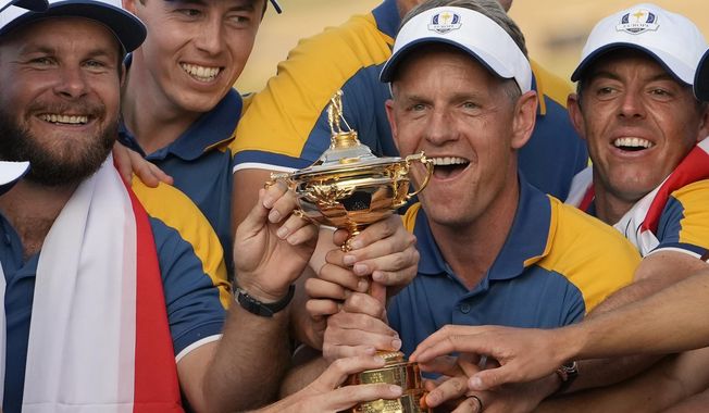 Europe&#x27;s Team Captain Luke Donald, centre, and team members lift the Ryder Cup after winning the trophy by defeating the United States 16/12 point to 11 1/2 points at the Marco Simone Golf Club in Guidonia Montecelio, Italy, on Oct. 1, 2023. Luke Donald is staying on as captain of the European team for its defense of the Ryder Cup in 2025 at Bethpage Black. The 45-year-old Donald led the Europeans to a 16陆-11陆 victory over the United States outside Rome last month and the European tour said Wednesday Nov. 29, 2023 he is being retained as captain. (AP Photo/Alessandra Tarantino, File)