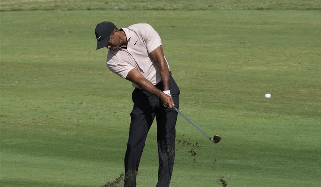 Tiger Woods hits from the first fairway during the first round of the Hero World Challenge PGA Tour at the Albany Golf Club, in New Providence, Bahamas, Thursday, Nov. 30, 2023. (AP Photo/Fernando Llano)