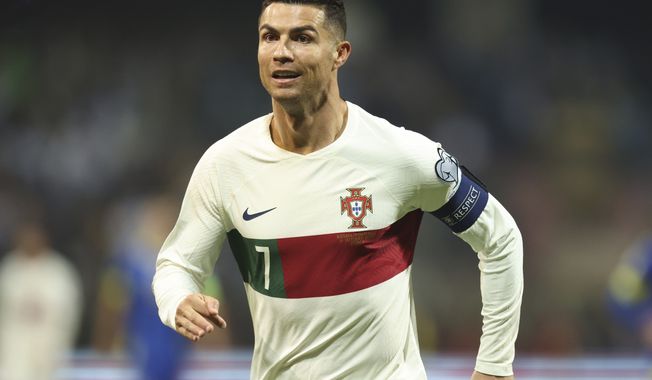 Portugal&#x27;s Cristiano Ronaldo reacts after scoring during the Euro 2024 group J qualifying soccer match against Bosnia-Herzegovina at the Bilino Polje Stadium in Zenica, Bosnia and Herzegovina, Oct. 16, 2023. Ronaldo has been hit with a billion dollar class-action lawsuit over his role in promoting cryptocurrency-related 鈥渘on-fungible tokens,鈥� or NFTs, issued by the beleaguered cryptocurrency exchange Binance. The lawsuit, filed in federal court in the Southern District of Florida Monday, Nov. 27, 2023 accuses Ronaldo鈥檚 promotions of Binance of being 鈥渄eceptive and unlawful.鈥� (AP Photo/Armin Durgut, file)