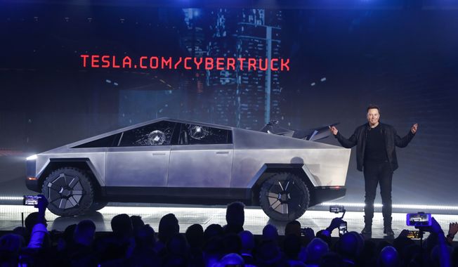 Tesla CEO Elon Musk introduces the Cybertruck at Tesla&#x27;s design studio on Nov. 21, 2019, in Hawthorne, Calif. The windows were broken during a demonstration intended to show the strength of the glass. Musk is expected to give an update on manufacturing problems with the long-awaited Cybertruck at an event Thursday marking the first deliveries of the futuristic, angular pickup truck. (AP Photo/Ringo H.W. Chiu)