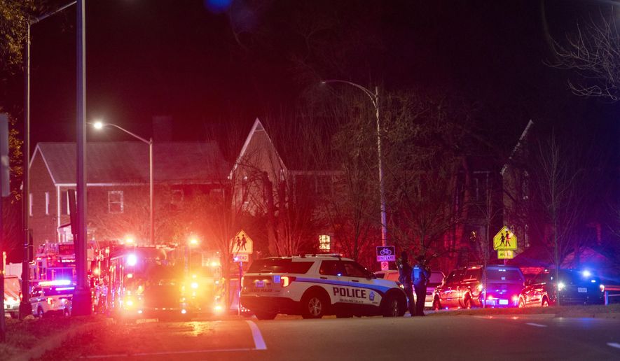 Arlington County Fire Department fire and police vehicles fill the street near the scene of a house explosion on Monday, Dec. 4, 2023, in Arlington, Va. (AP Photo/Kevin Wolf)