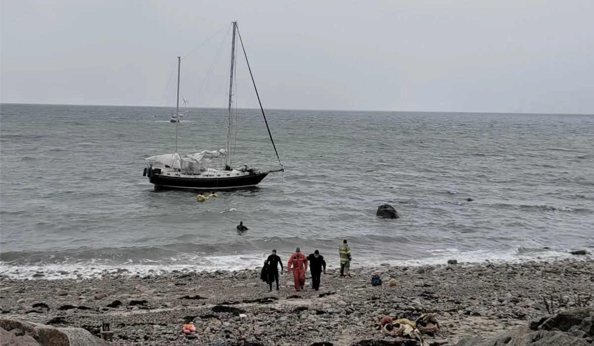 NextImg:Massachusetts firefighters rescue trio of people whose ship ran aground