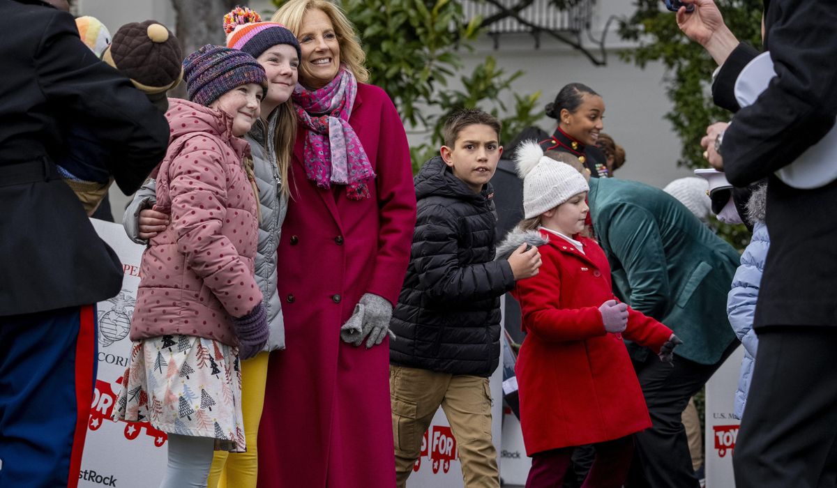 NextImg:Jill Biden and military kids sort toys the White House donated to the Marine Corps Reserve program