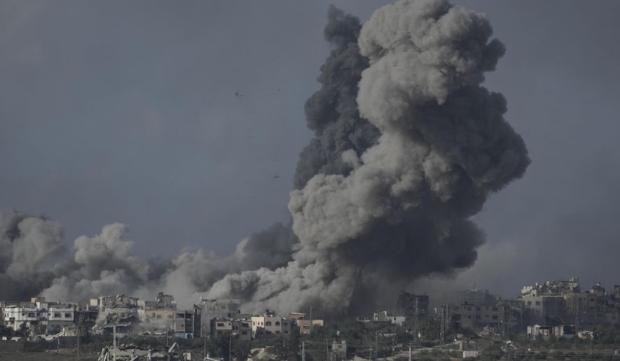 Smoke rises from the Gaza Strip after Israeli strikes on Saturday, Dec. 9, 2023. (AP Photo/Leo Correa) ** FILE **