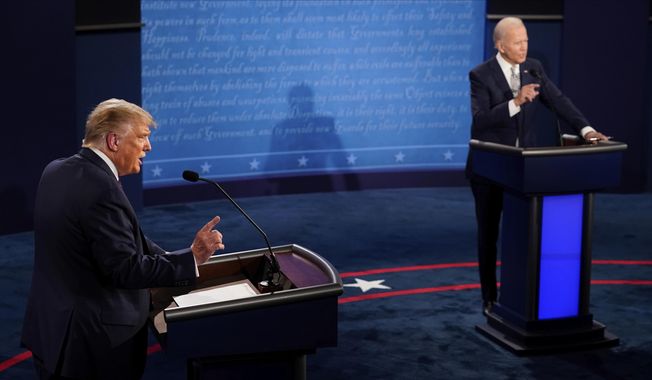 Then-President Donald Trump and Democratic presidential candidate former Vice President Joe Biden exchange points during the first presidential debate on Sept. 29, 2020, at Case Western University and Cleveland Clinic, in Cleveland, Ohio. (AP Photo/Morry Gash, Pool, File)