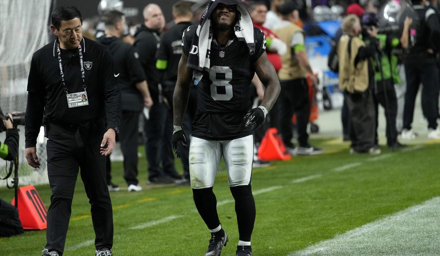 Las Vegas Raiders running back Josh Jacobs (8) leaves the game with an injury against the Minnesota Vikings during the second half of an NFL football game, Sunday, Dec. 10, 2023, in Las Vegas. (AP Photo/John Locher)