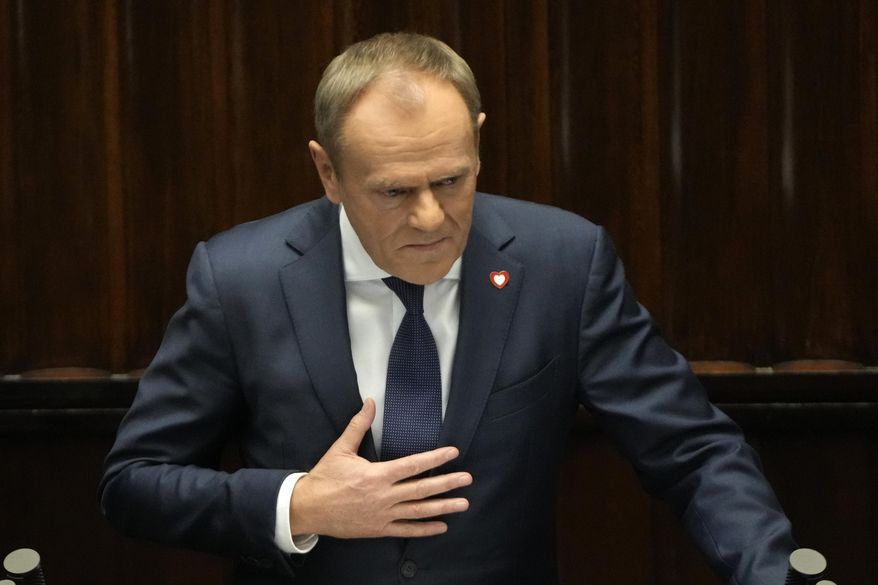Newly elected Poland's Prime Minister Donald Tusk addresses lawmakers during his speech at the parliament in Warsaw, Poland, Tuesday Dec. 12, 2023. (AP Photo/Czarek Sokolowski)