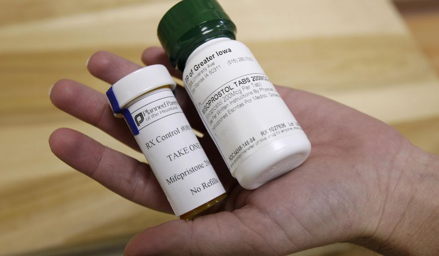 Bottles of abortion pills mifepristone, left, and misoprostol, right, at a clinic, Sept. 22, 2010, in Des Moines, Iowa. A judge in Wyoming will decide as soon as Thursday, Dec. 14, 2023, whether to strike down, uphold or hold a trial over the state&#x27;s abortion bans including its first-in-the-nation explicit ban on abortion pills. (AP Photo/Charlie Neibergall, File)