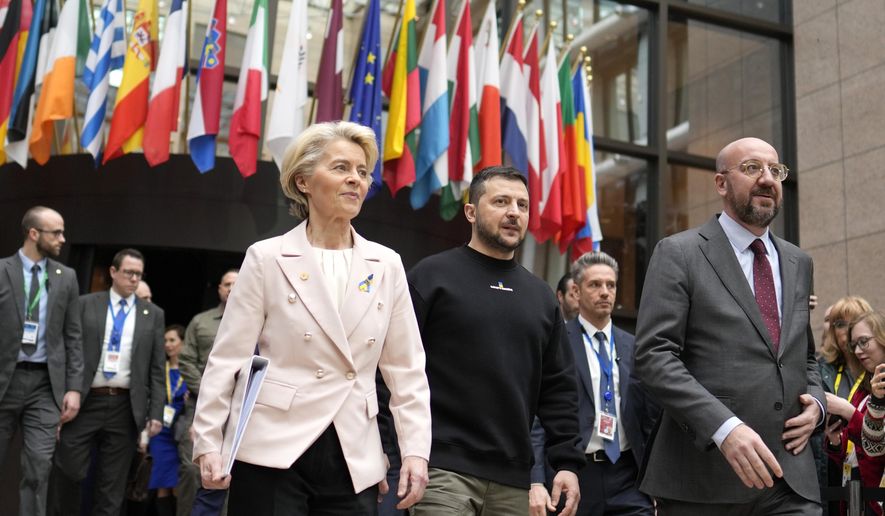 From left, European Commission President Ursula von der Leyen, Ukraine&#x27;s President Volodymyr Zelenskyy and European Council President Charles Michel walk together during an EU summit in Brussels on Feb. 9, 2023. The European Union decided Thursday, Dec. 14, 2023 to open accession negotiations with Ukraine, a stunning reversal for a country at war that had struggled to find the necessary backing for its membership aspirations and long faced opposition from Hungarian Prime Minister Viktor Orban. (AP Photo/Virginia Mayo, File)