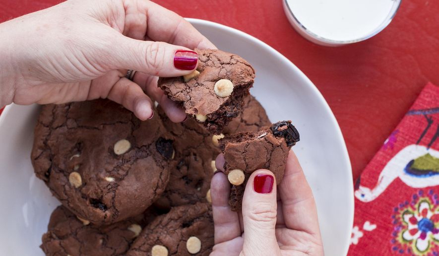 This 2017 image provided by Katie Workman shows chocolate brownie cookies with dried cherries and white chocolate chips in New York. (Katie Workman via AP)