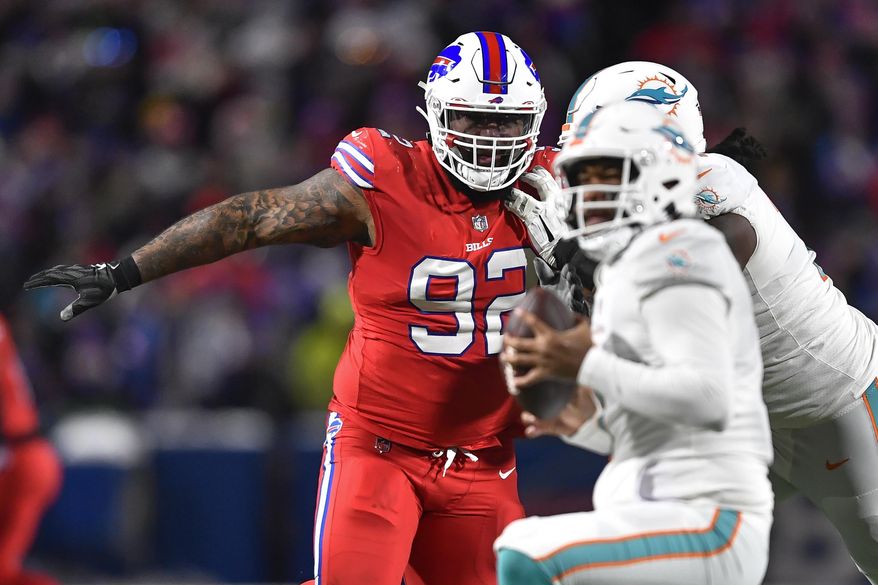 Buffalo Bills defensive tackle DaQuan Jones (92) pressures Miami Dolphins quarterback Tua Tagovailoa (1) during the second half of an NFL football game in Orchard Park, N.Y., Saturday, Dec. 17, 2022. The Buffalo Bills opened a three-week window on Tuesday, Dec. 19, 2023, for starting defensive tackle DaQuan Jones to be activated from injured reserve after missing nine games with a torn pectoral muscle. While the chances of Jones’ being activated are promising, coach Sean McDermott said it was unlikely that will happen in time for Saturday, when Buffalo (8-4) travels to play the Los Angeles Chargers (5-9). (AP Photo/Adrian Kraus, File)