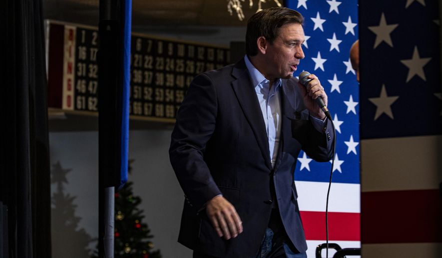 Florida Gov. Ron DeSantis takes the stage during a Meet and Greet at VFW Post 788 in Cedar Rapids, Iowa on Tuesday, Dec. 19, 2023. DeSantis and Rep. Chip Roy, R-Texas, spoke to community members and held a question and answer session. (Nick Rohlman/The Gazette via AP)