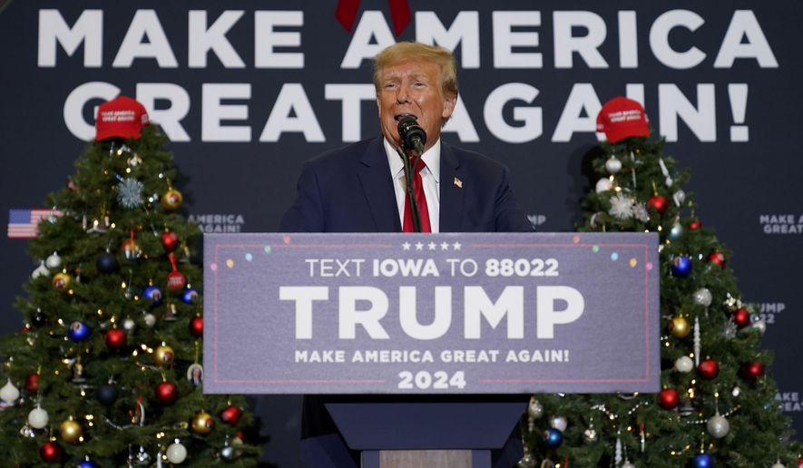 Former President Donald Trump speaks during a commit to caucus rally, Tuesday, Dec. 19, 2023, in Waterloo, Iowa. (AP Photo/Charlie Neibergall)