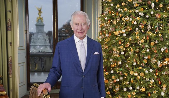 Britain&#x27;s King Charles III poses for a photo, during the recording of his Christmas message at Buckingham Palace, in London, Saturday, Dec. 7, 2023. (Jonathan Brady/Pool Photo via AP)