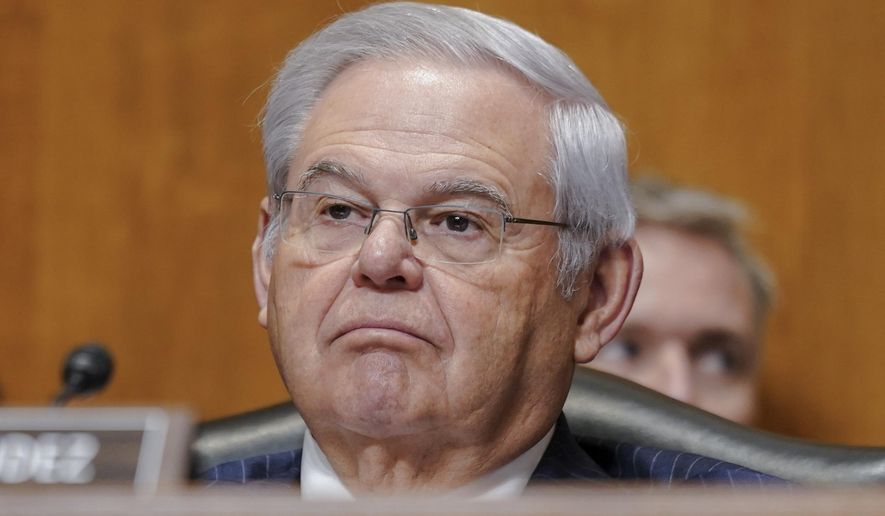 Sen. Bob Menendez, D-N.J., listens during a Senate Foreign Relations Committee on Capitol Hill, Dec. 7, 2023, in Washington. Federal prosecutors on Tuesday, Dec. 26, urged a judge to reject Menendez’s request to delay his bribery trial scheduled for next spring by two months until July 2024. (AP Photo/Mariam Zuhaib, File)