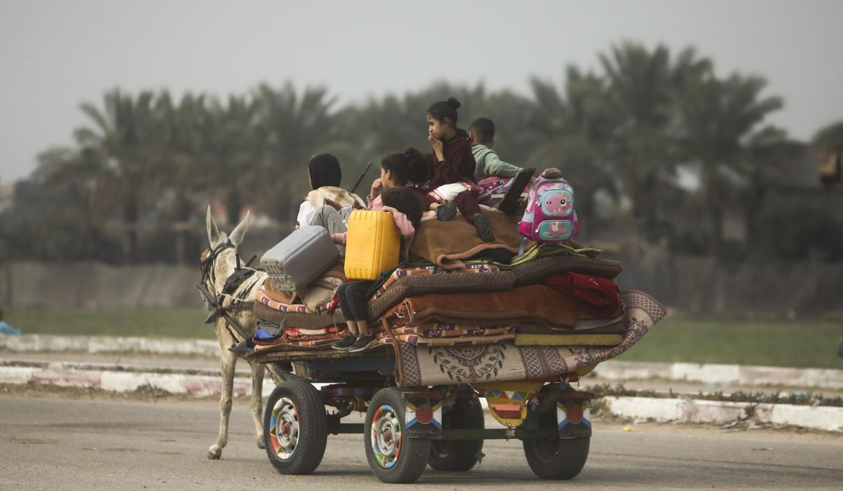NextImg:On foot and by donkey cart, thousands flee widening Israeli assault in Gaza