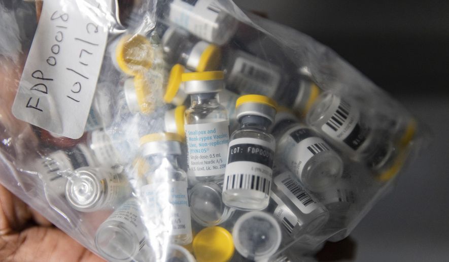 Vials of single doses of the Jynneos vaccine for monkeypox are seen from a cooler at a vaccination site on Aug. 29, 2022, in the Brooklyn borough of New York. As Congo copes with its biggest outbreak of mpox, scientists warn discrimination against gay and bisexual men on the continent could make it worse. (AP Photo/Jeenah Moon, File)