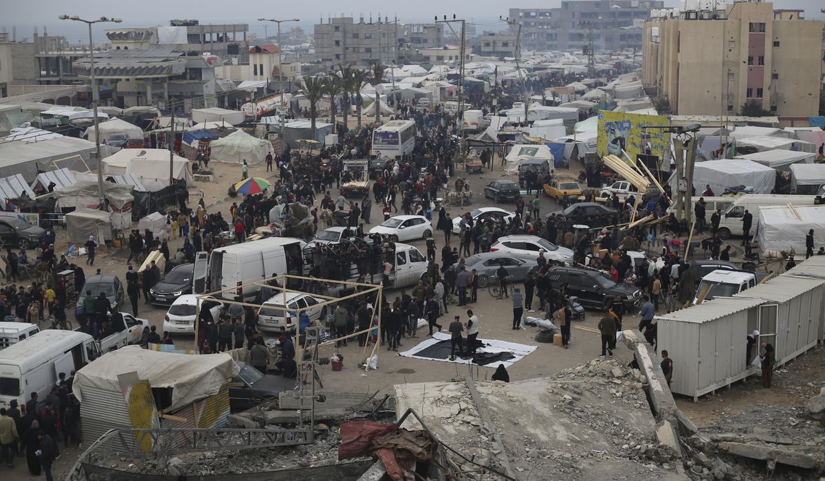NextImg:Live updates | Tens of thousands of Palestinians stream into Rafah as Israel expands its offensive