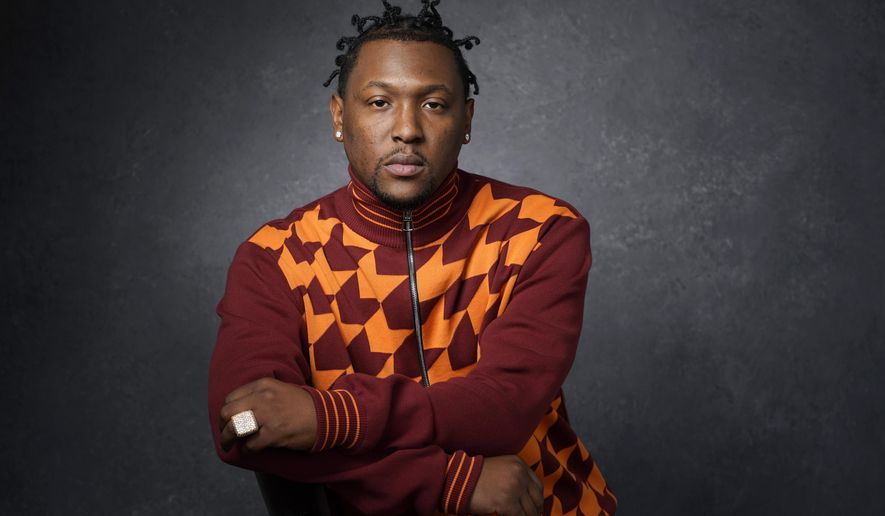 FILE - Record producer and recording artist Hit-Boy poses for a portrait, Tuesday, March 8, 2022, in Los Angeles. When Hit-Boy walks the Grammy red carpet, he expects to proudly strut into the Feb. 4, 2024 awards ceremony with his father beside him for the first time. (AP Photo/Chris Pizzello, File)