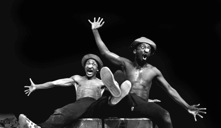Performers Percy Mtwa, left, and Mbongeni Ngema in a scene from &quot;Woza Albert&quot; at the Market Theatre in Johannesburg, South Africa, in 1981. Ngema, renowned South African playwright, producer and composer has died in a fatal car crash at the age of 68, his family confirmed on Wednesday, Dec. 27, 2023. (AP Photo/Ruphin Coudyzer/File)