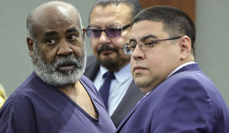 Duane &quot;Keffe D&quot; Davis, left, with deputy special public defenders Robert Arroyo, right, and Charles Cano, rear, appears for his arraignment at the Regional Justice Center, Nov. 2, 2023, in Las Vegas. The former Los Angeles-area gang leader accused of murder in the killing of hip-hop music icon Tupac Shakur in 1996 in Las Vegas is seeking to be released to house arrest ahead of his murder trial in June 2024. A Nevada judge on Tuesday, Dec. 19, 2023, set a Tuesday, Jan. 2, 2024, hearing on the request by Davis. (Ethan Miller/Pool Photo via AP, File)