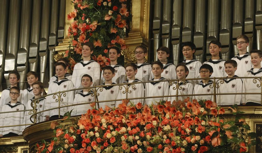 The Vienna Boys&#x27; Choir perform together with the Vienna Philharmonic Orchestra during the traditional New Year&#x27;s concert at the golden hall of the Musikverein in Vienna, Austria, on Jan. 1, 2016. The Austrian government said Saturday Dec. 30, 2023 that it is giving the country&#x27;s centuries-old Vienna Boys Choir 800,000 euros ($884,000) to help it out of severe financial difficulties. (AP Photo/Ronald Zak, File)