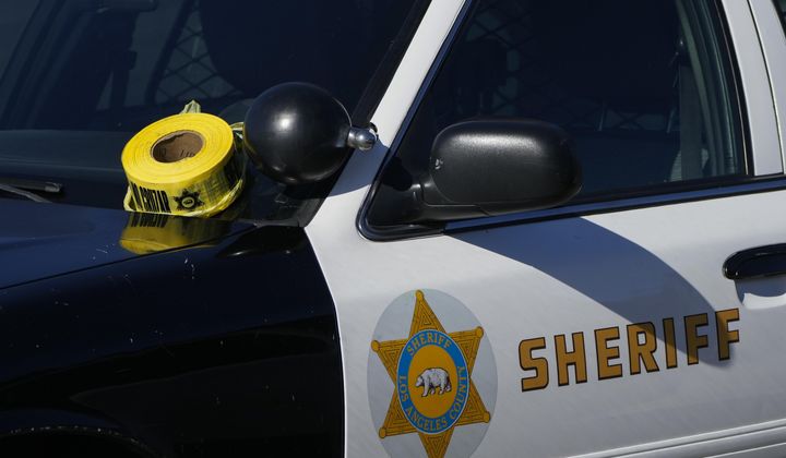A roll of police tape is left on the windshield of a Los Angeles County sheriff&#x27;s vehicle in the parking lot of its training academy in Whittier, Calif., Nov. 16, 2022. (AP Photo/Jae C. Hong, File) **FILE**